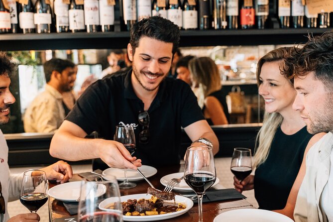 Madrid Local Tapas, Wine Bars & Flamenco Show - Iberian ham and a walk through Plaza Mayor