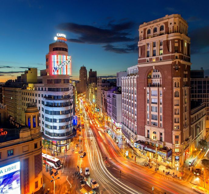 Madrid: Sunset Walking Tour with Optional Flamenco Show - Gran Vía after dark