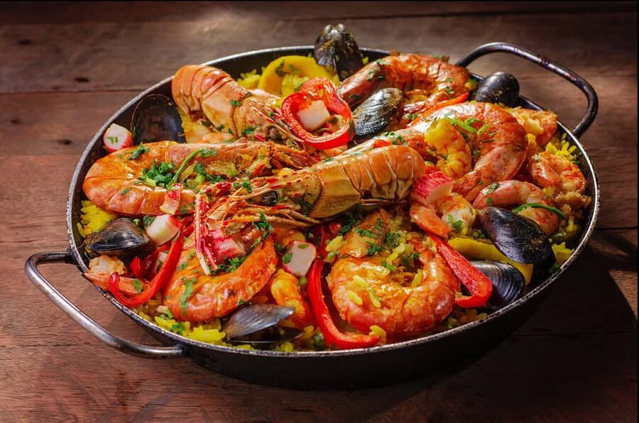 Malaga: PREMIUM TAPAS TOUR Paella, Tapas, Winery & Flamenco - The first restaurant: three traditional dishes and a drink