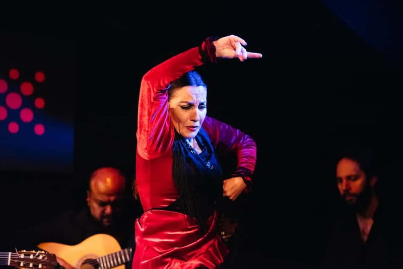 Seville: Tapas Walking Tour with Traditional Flamenco Show - Walking through central Seville to the flamenco venue