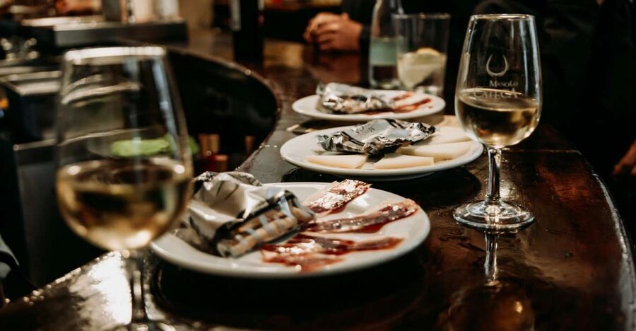 Triana: Authentic Flamenco & Tapas Tour - The abacería stop begins with small local tastes